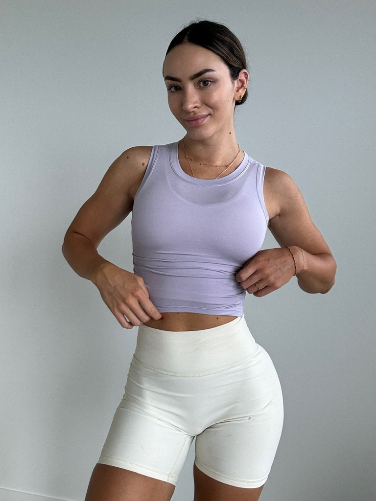 lilac top, cream sport shorts, lilac sports bra, spring outfit ideas, spring street style inspiration, ethical fashion, sustainable activewear uk, move with purpose, sport bras, sport leggings, yoga, pilates clothing for women